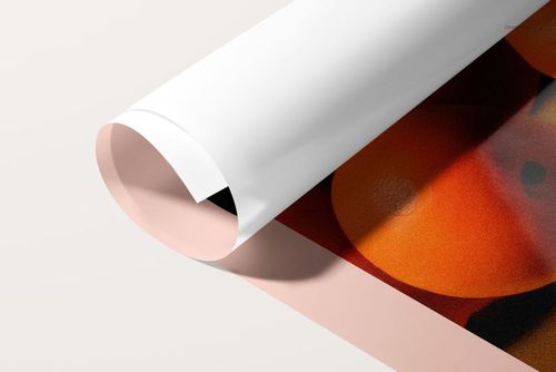 Close-up view of a rolled PVC poster mockup featuring glossy finish and bold orange artwork on a pale surface.