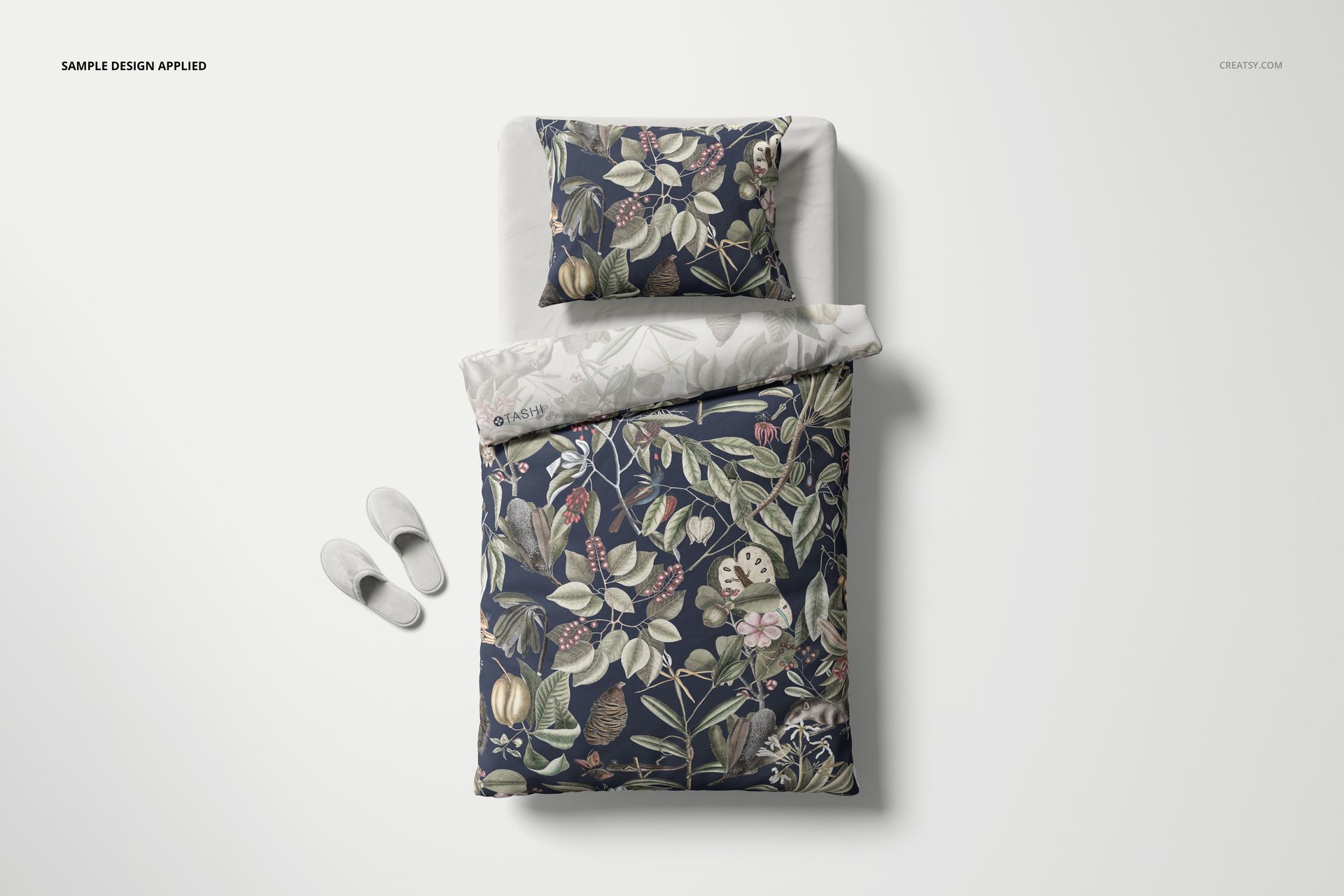 Austrian size bedding set mockup with floral patterned duvet and pillow, shown from a top view on a white background.