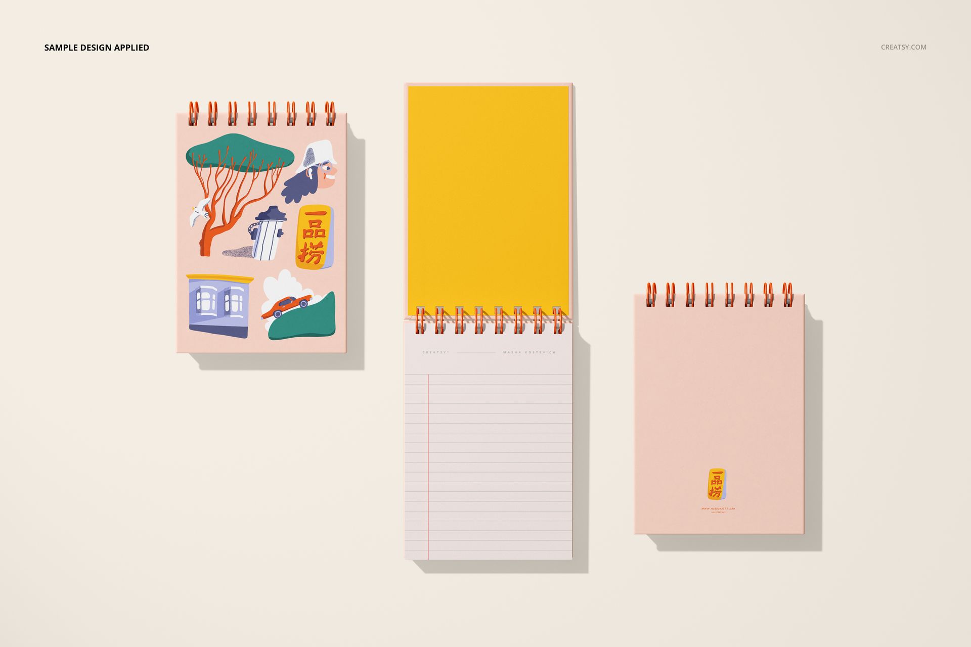 Three spiral ring flip top notebooks displayed on a light surface, featuring colorful covers and lined pages.
