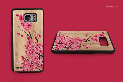 PSD mockup of a wooden phone case featuring a vibrant pink floral pattern, displayed on a red backdrop.