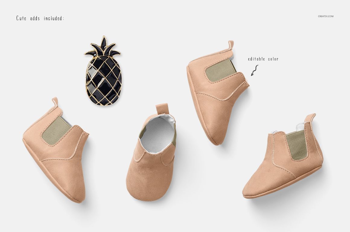 Mockup of baby shoes in soft tan color, featuring side elastic panels and a top view, with a decorative pin.