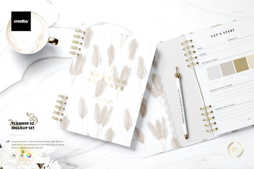 Spiral-bound planner with beige leaf pattern cover and open page, gold pen, and white background in stationery mockup.