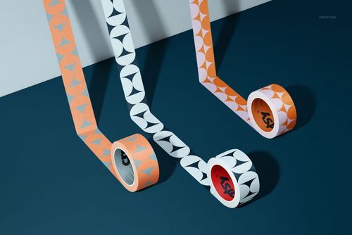 Packaging tape mockup featuring rolls with bold geometric designs in orange and white, viewed from an angled perspective.