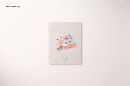 Front view of a stationery set mockup featuring a closed booklet with a floral design on a light background.