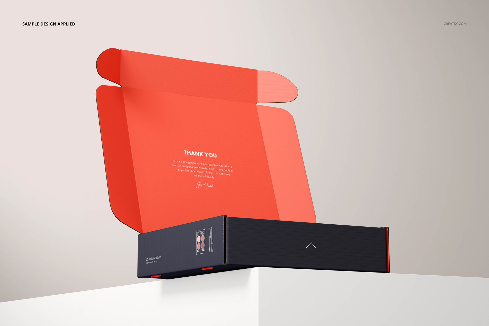 Rectangular mailing box mockup with open lid, featuring a black exterior and vibrant orange interior on a white surface.