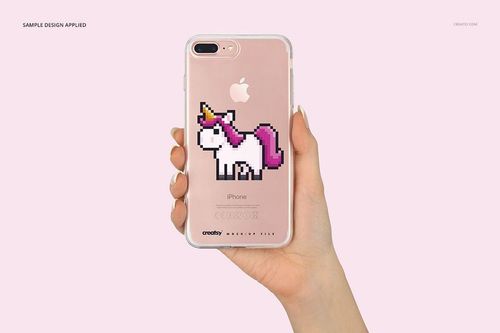 iPhone 7 Plus clear case mockup with a pixel unicorn illustration, held up by a hand on a pastel pink backdrop.
