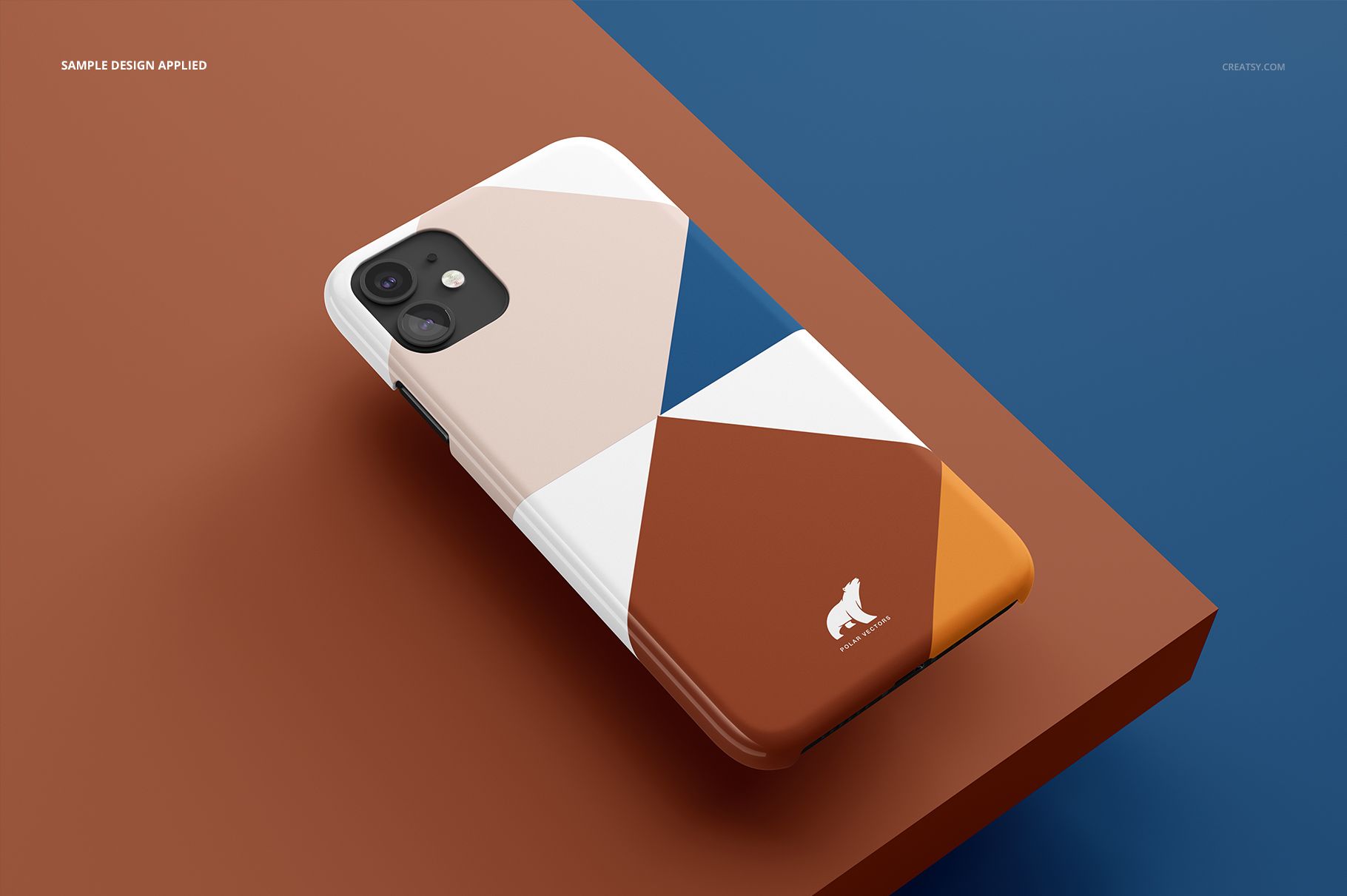 Glossy iPhone 11 snap case mockup displaying a geometric pattern in brown, beige, blue, and white on a color-blocked surface.