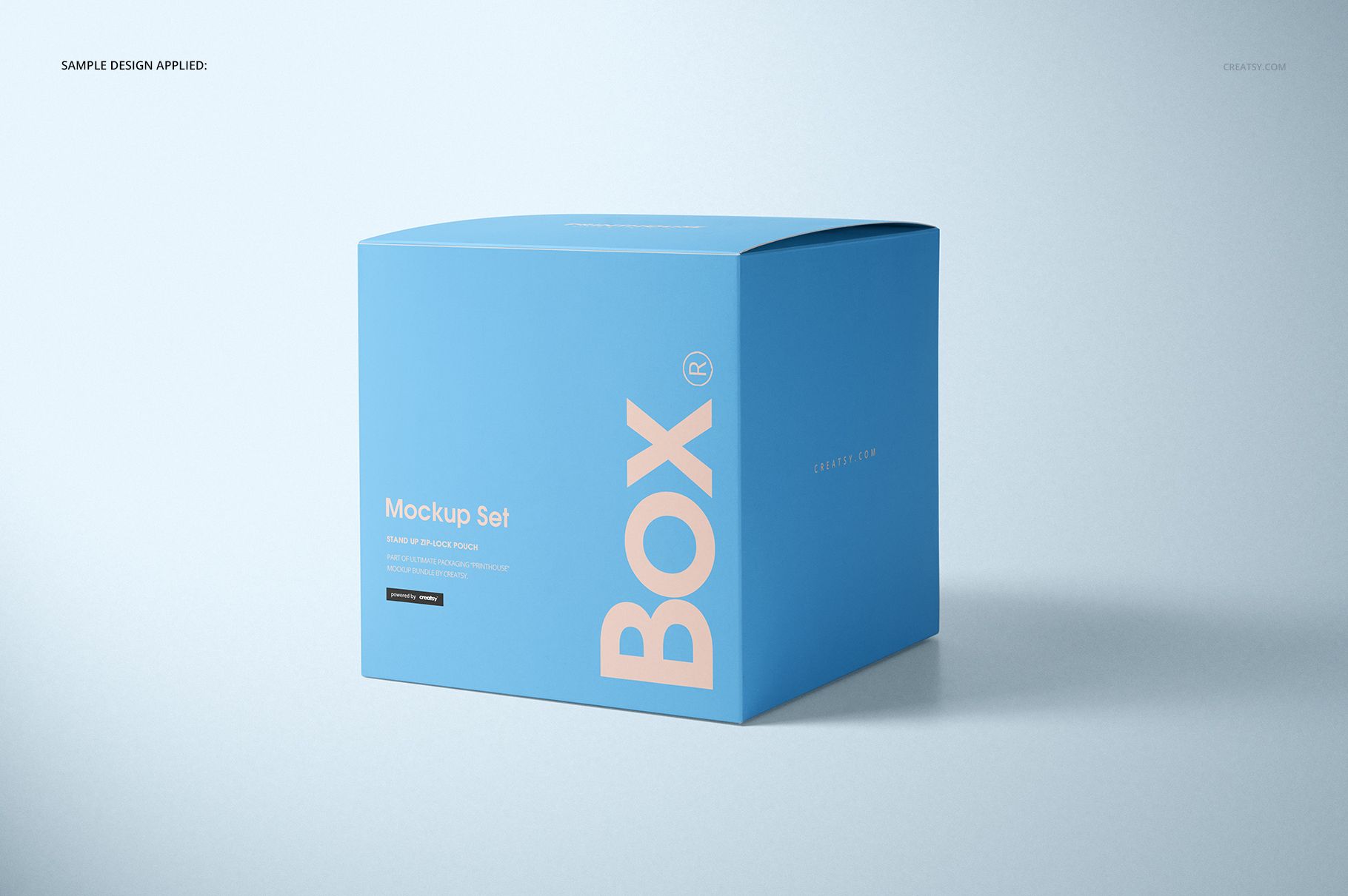 Matte square box mockup in pastel blue, featuring minimal text, displayed with soft shadows on a light surface.