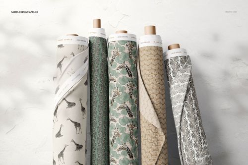 Fabric rolls mockup showing diverse textile prints including giraffes, leaves, and geometric shapes, viewed from the front.