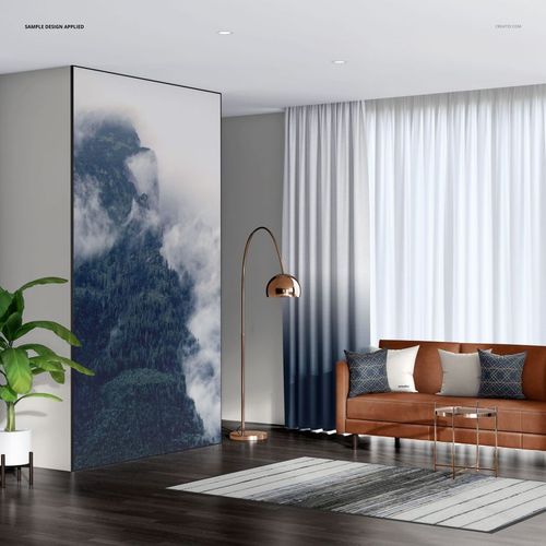 Living room PSD mockup with a large wall-mounted textile frame, patterned rug, and decorative pillows.