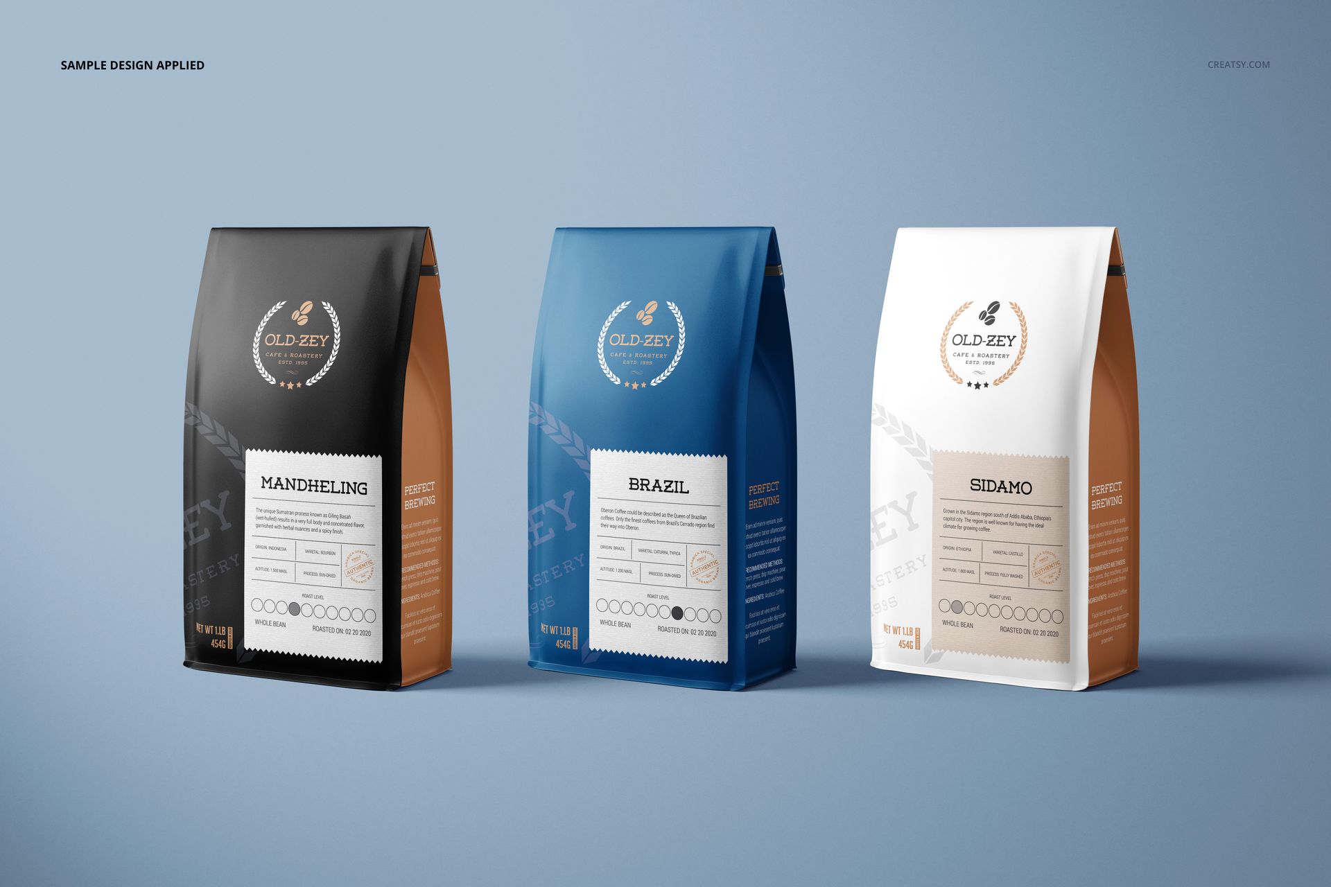 Three upright paper coffee bag mockups in black, blue, and white, arranged side by side on a blue background.