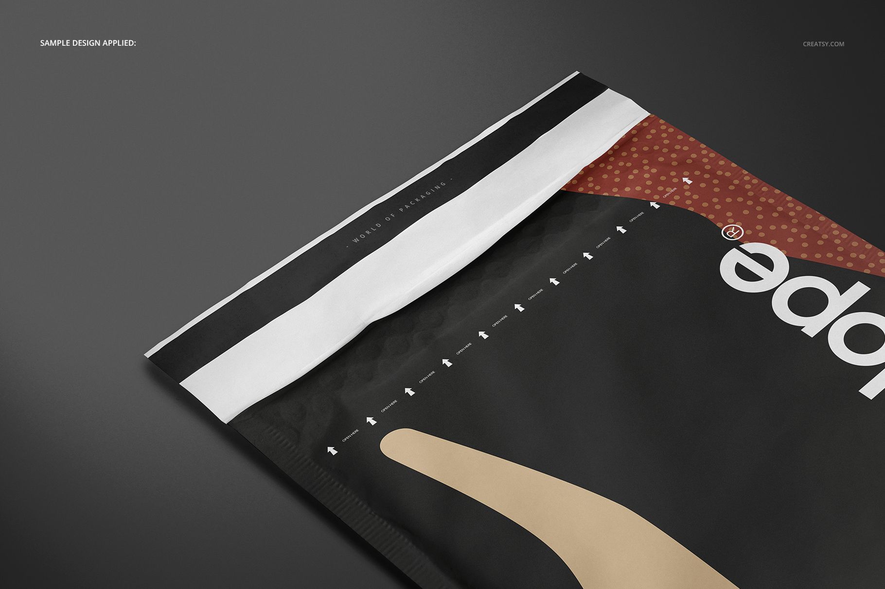 Close-up view of a rectangular envelope mockup with black, white, and brown colors on a dark surface.