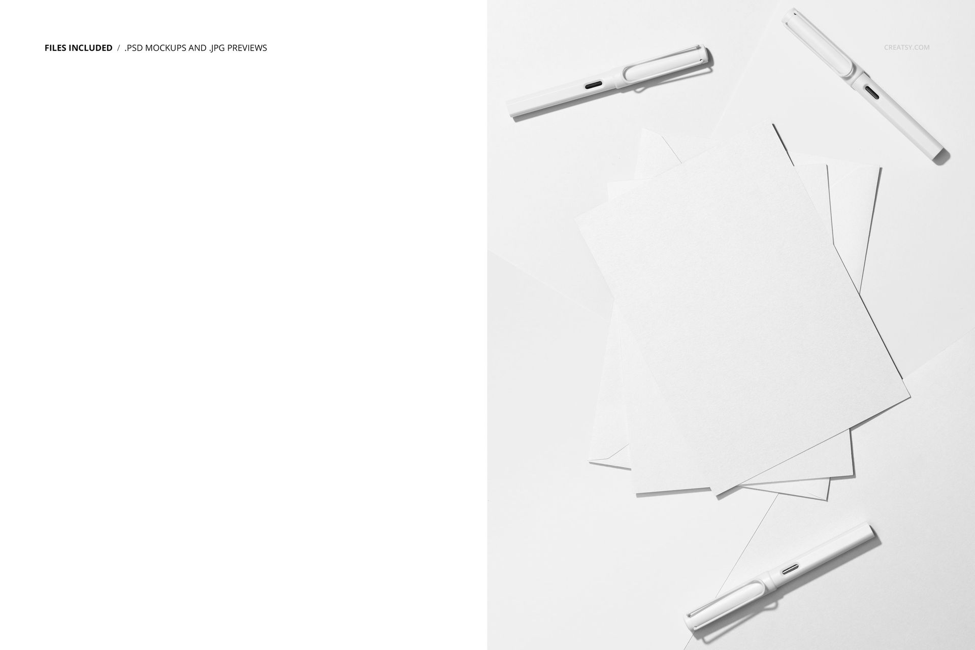 Top view of blank greeting cards and envelopes arranged on a white surface with white pens, creating an abstract scene.