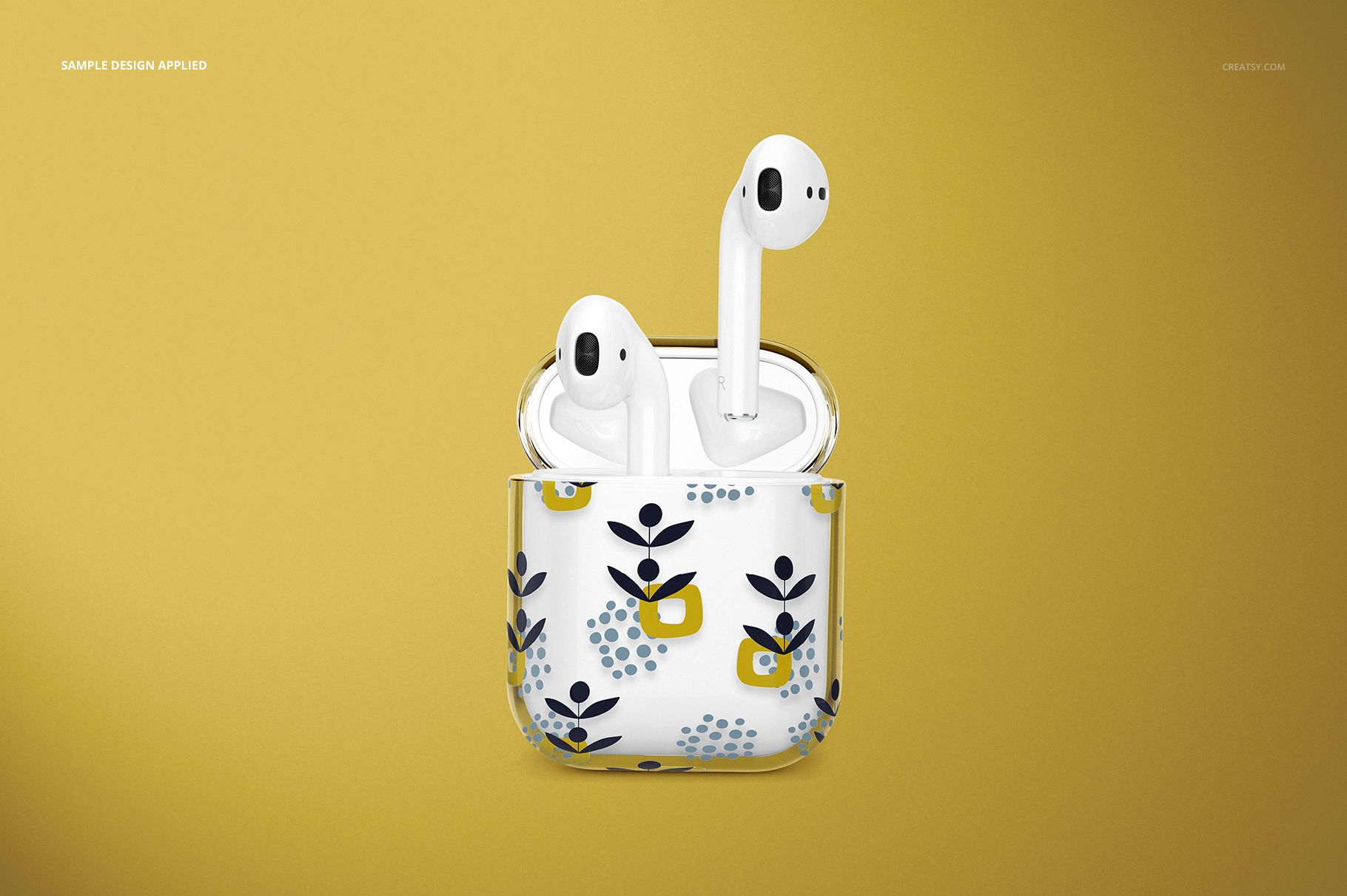 PSD mockup of clear AirPods case with stylized blue and yellow flowers, open to reveal AirPods, front-facing on yellow.