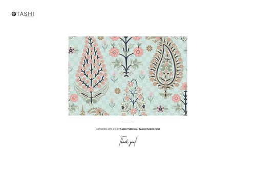 Cotton fabric swatch mockup displayed on a wall, showing a light blue background with floral motifs.