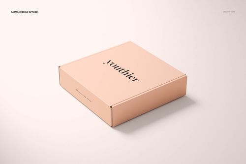 Light peach square packaging box mockup with simple black lettering, displayed at a slight angle on a neutral surface.