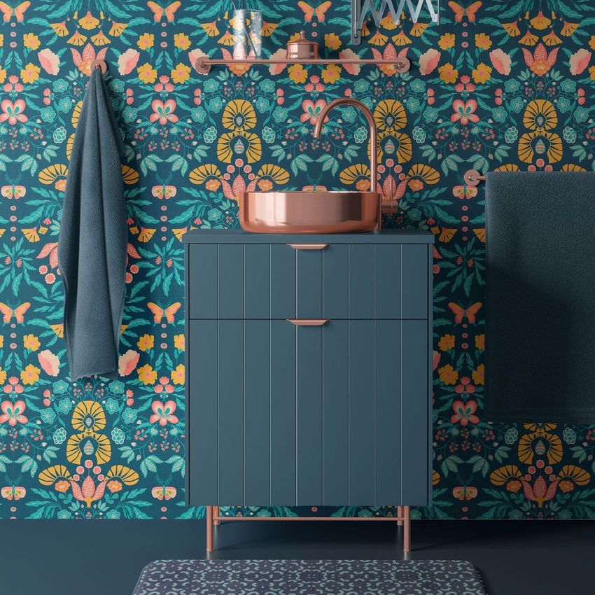 Bathroom wallpaper mockup showing a vanity with a copper sink, teal cabinet, and colorful folk-inspired wallpaper pattern.