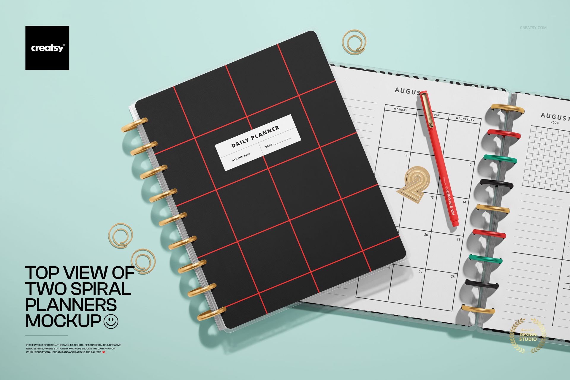 Stationery PSD mockup featuring two spiral planners from above, with one planner open and colorful tabs visible.