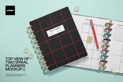 Stationery PSD mockup featuring two spiral planners from above, with one planner open and colorful tabs visible.