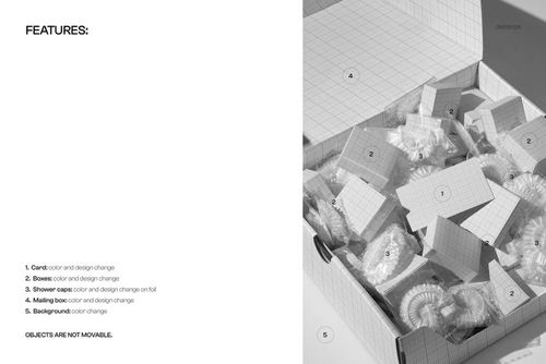 Top view of a mailing box mockup filled with wrapped shower caps and grid-patterned cards on a light surface.