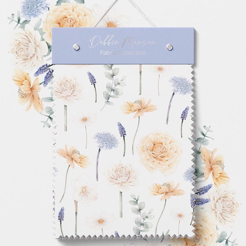 Fabric swatches mockup featuring a floral pattern with pastel flowers and greenery on a white background, hung on a light purple board.