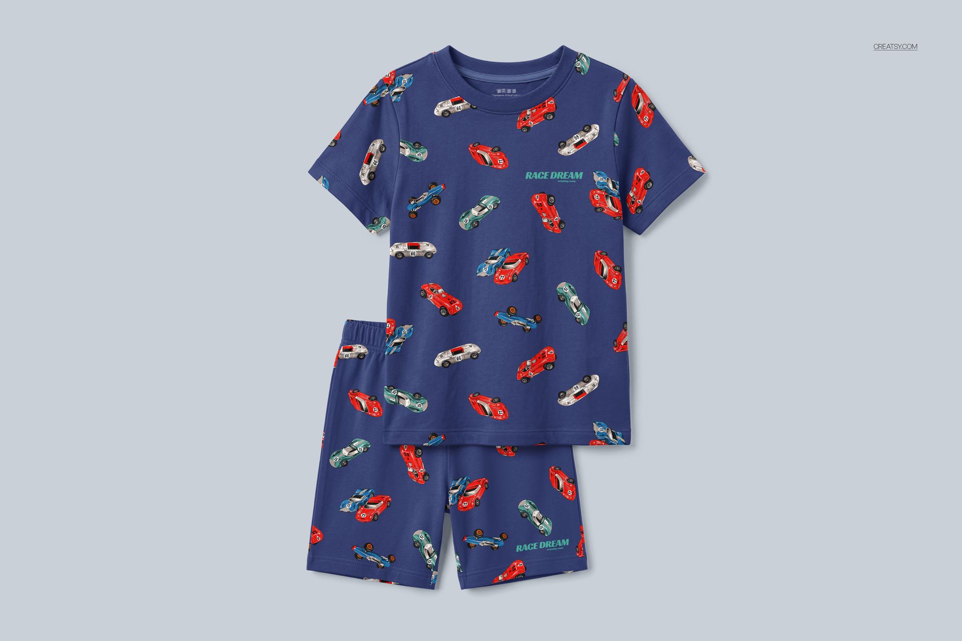 Front view of a blue kids pyjama mockup set with short sleeves and shorts, decorated with red and white cars.