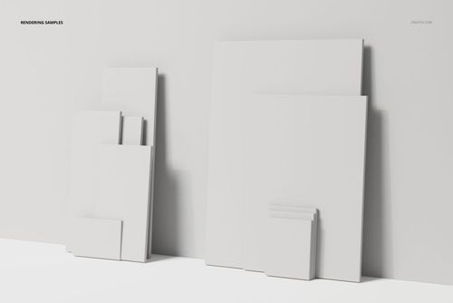Assorted blank canvas panels in various sizes arranged against a white wall, shown from a front angle in soft light.