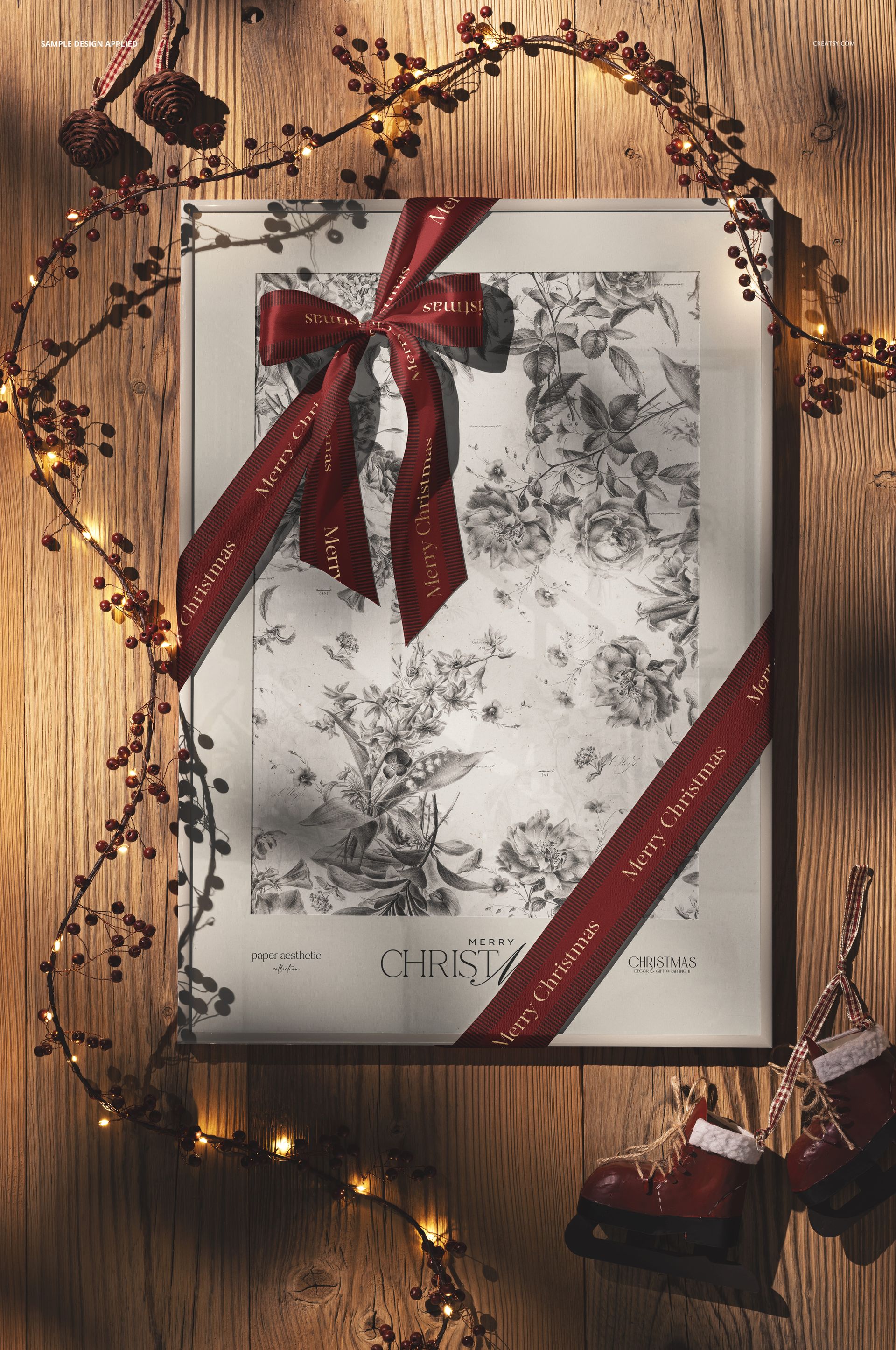 Vintage Christmas picture frame mockup with red ribbon, festive berries, and ice skate ornament on wooden surface.