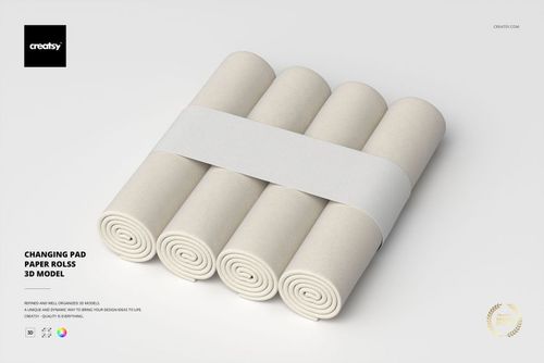 Four rolled changing pad papers in light beige color arranged side by side, viewed from a top angle on a plain background.