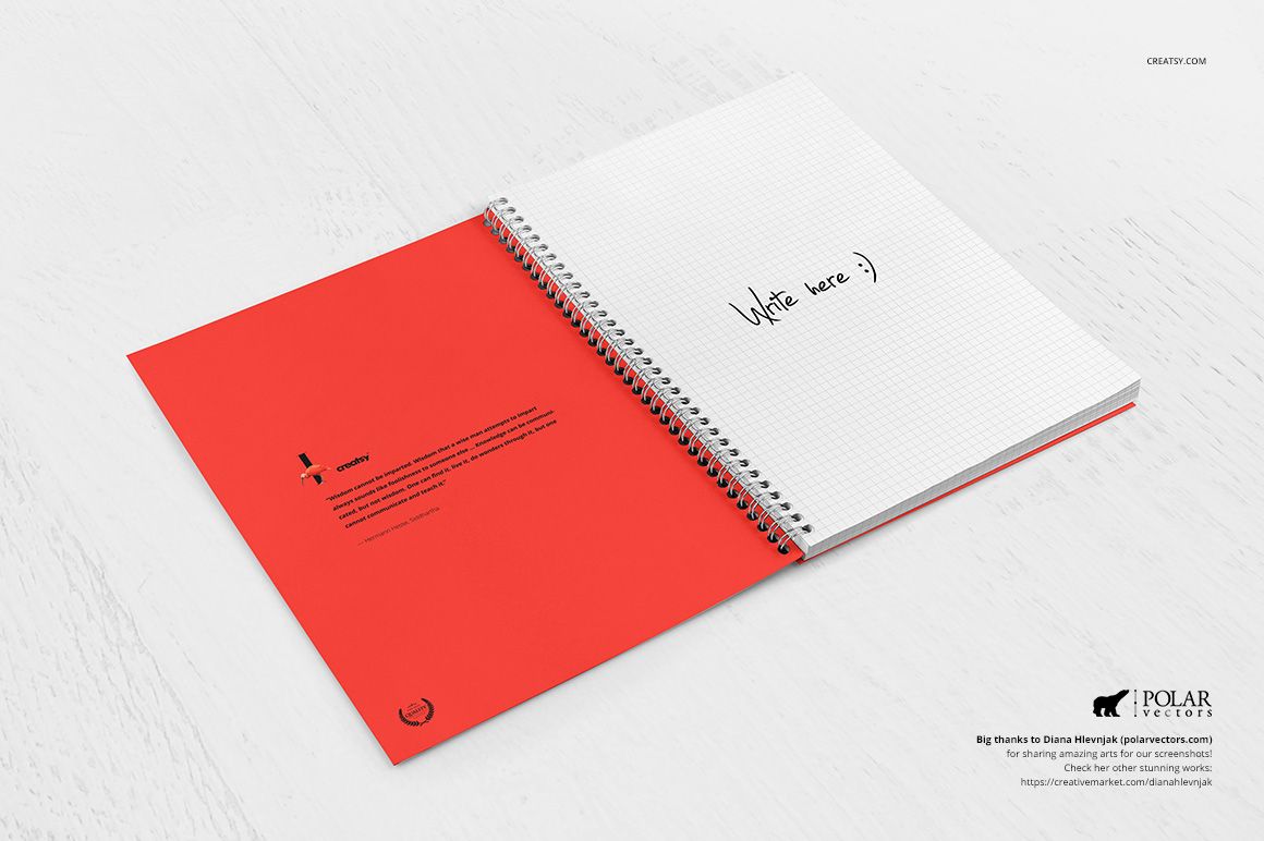 Open spiral notebook mockup with a red cover and grid paper, displayed on a light wooden surface in top view.