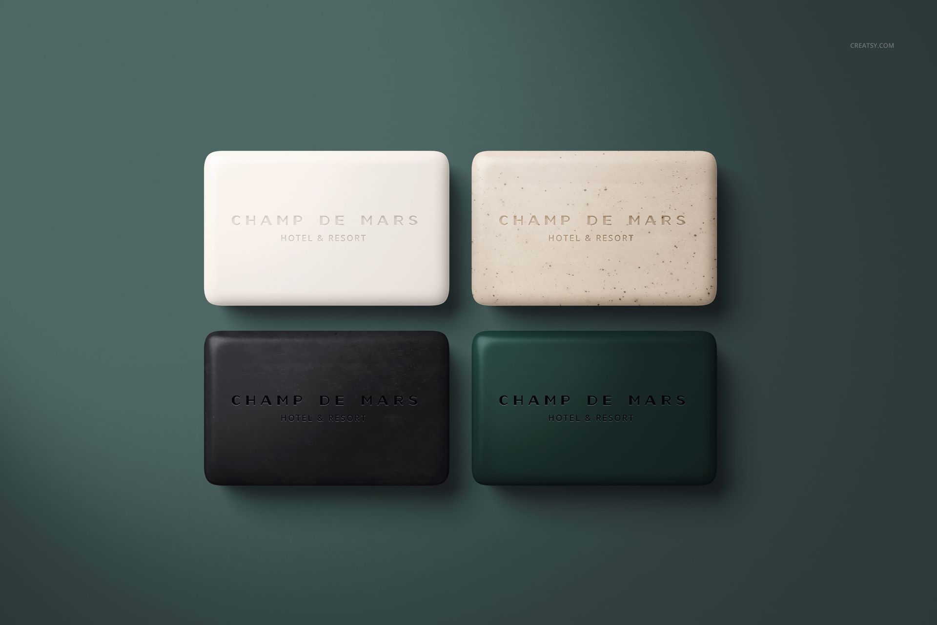 PSD mockup showing four hotel hand soap bars arranged in a grid, each with different solid colors and textures.