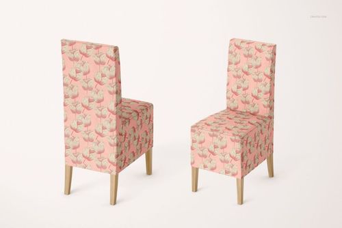 Pair of chairs with pink and beige flower print covers, displayed in a mockup set with neutral backdrop and wooden legs.