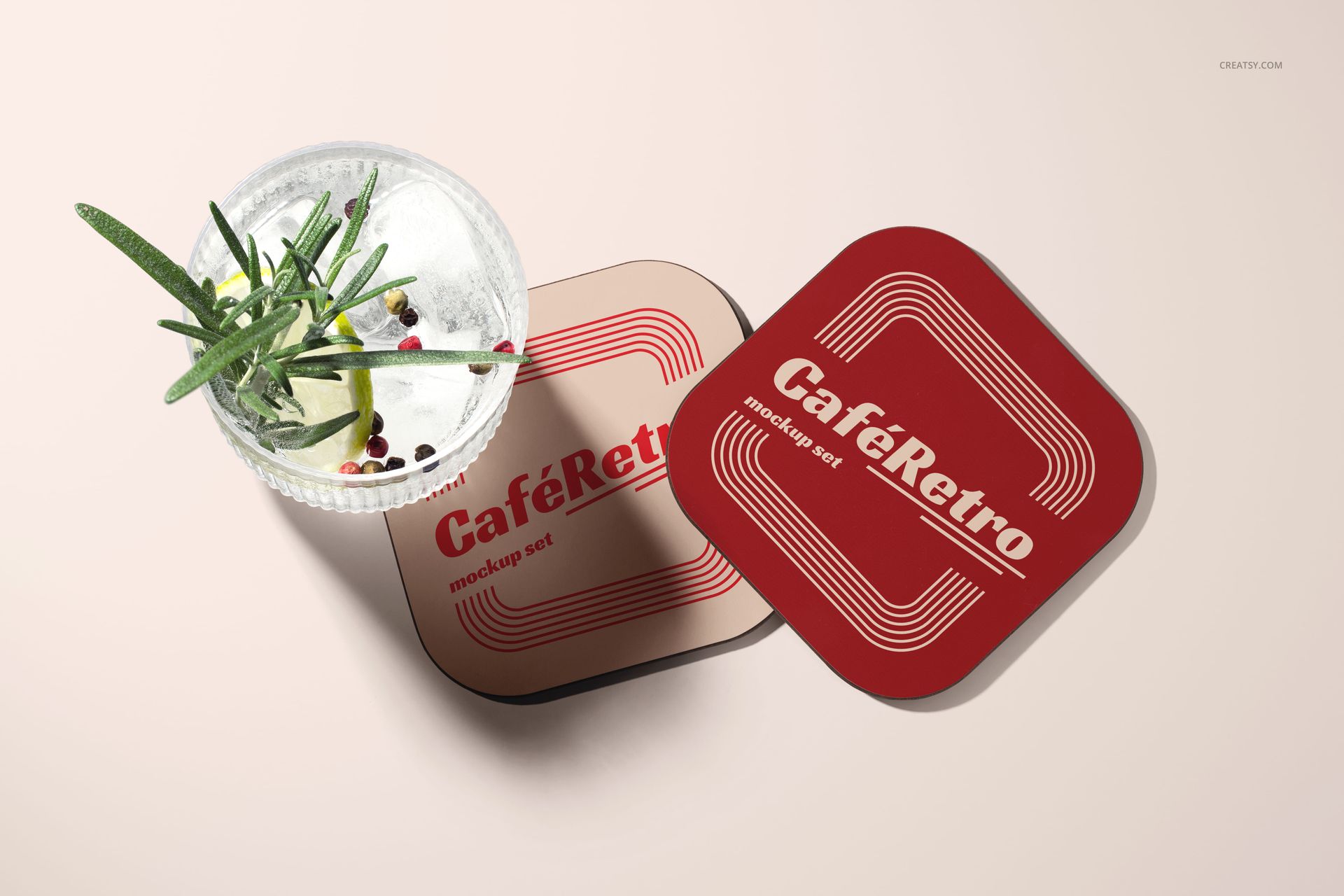 PSD mockup featuring two vintage-style coasters and a cocktail glass, arranged on a softly lit tabletop.