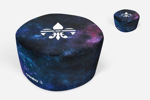 PSD mockup set with a round and cube ottoman, both decorated with cosmic colors and a central white graphic, neutral backdrop.