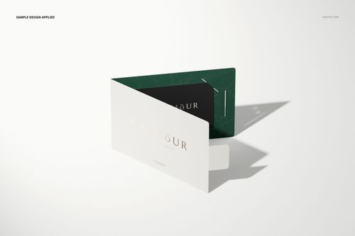 Gift card holder mockup featuring a folded white card with a green interior, displayed on a light surface at an angle.
