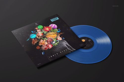 PSD mockup of a colored vinyl record and creative album sleeve with planets and fruit, displayed on a black background.