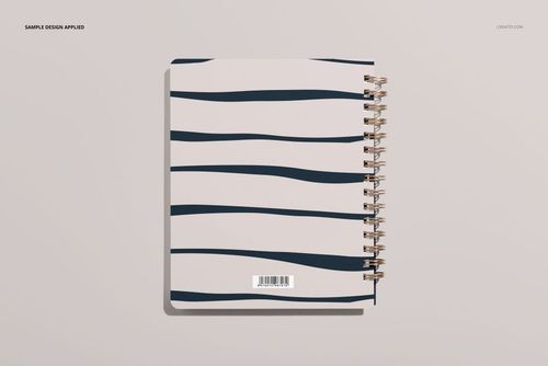 Little coiled notebook mockup showing a spiral-bound cover with dark blue wavy lines on a pale background.