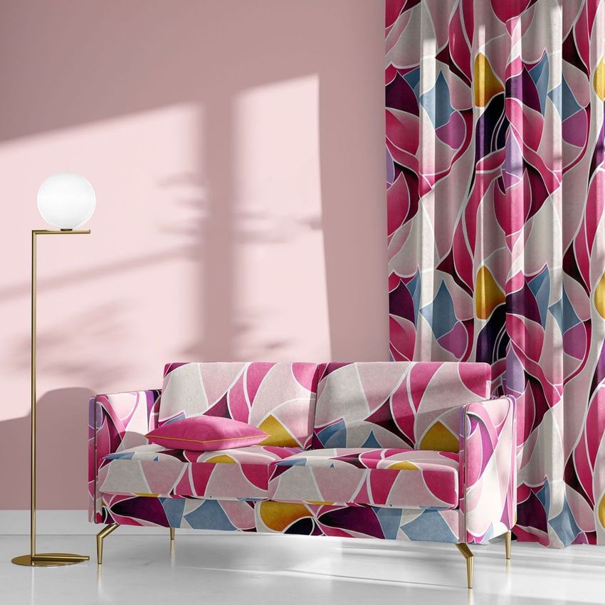 Living room scene mockup with a modern sofa and curtain featuring bold abstract patterns in pink, purple, and yellow tones.