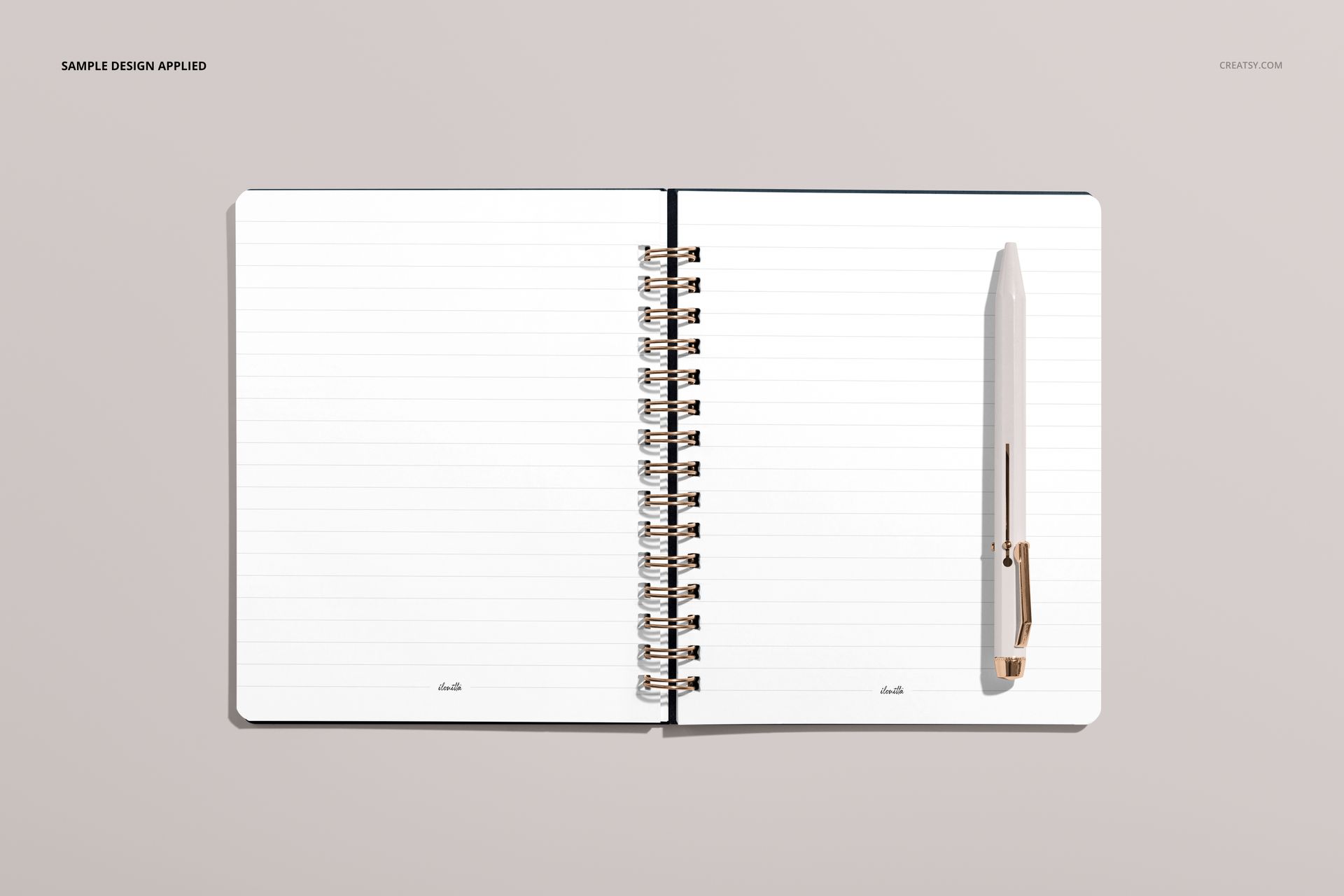 Little coiled notebook mockup showing blank lined sheets and a white pen, displayed flat on a light beige tabletop.