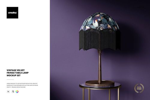 Front view of a mockup table lamp featuring a dark velvet fringe and colorful botanical design on the lampshade.