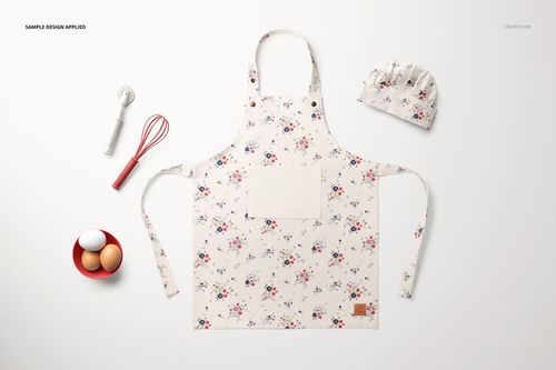 Kids apron mockup set featuring a light-colored apron with small floral prints, chef hat, and baking props arranged nearby.
