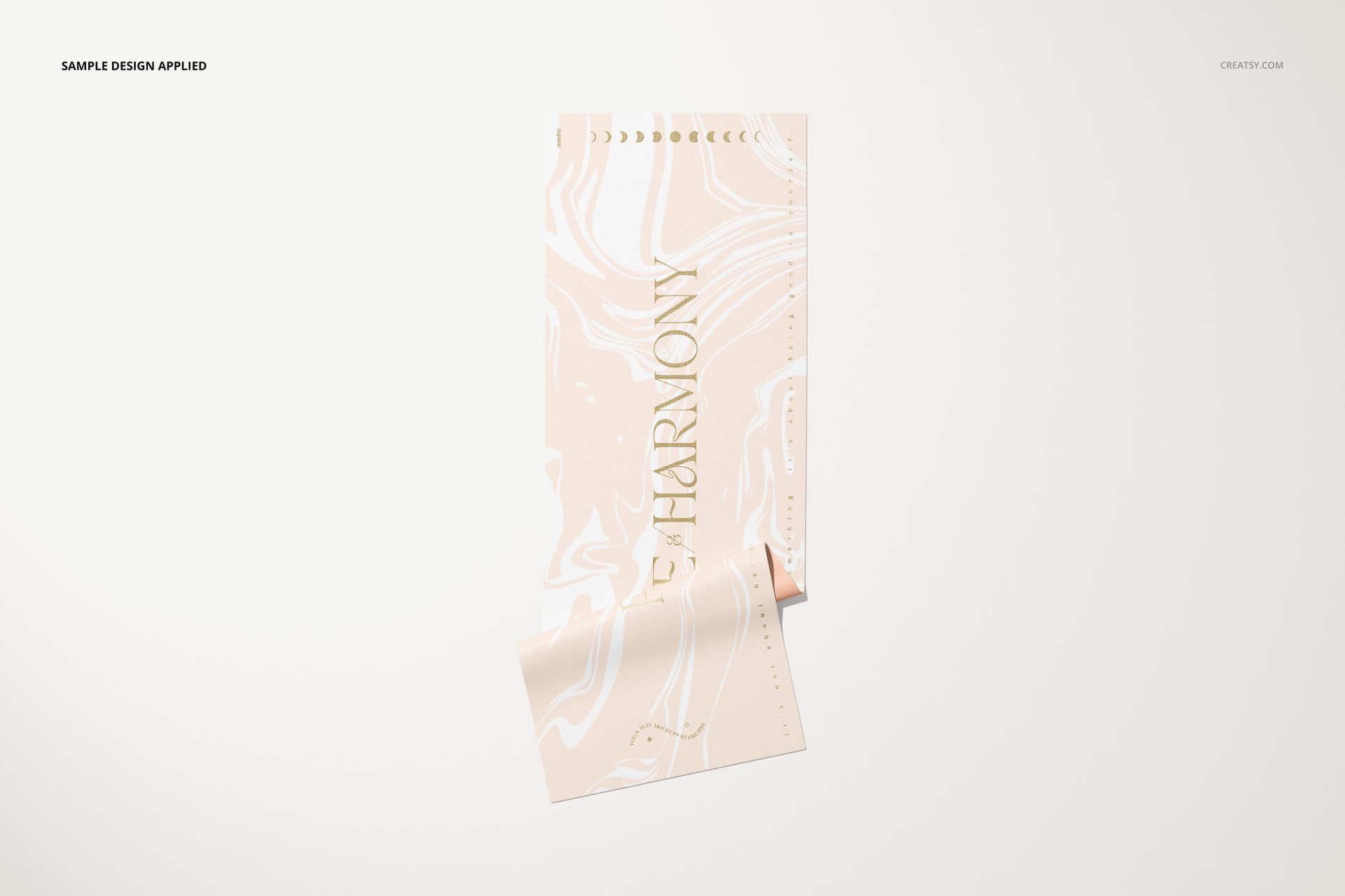 Rolled yoga mat mockup featuring a soft pastel swirl design and metallic lettering, displayed on a clean surface.