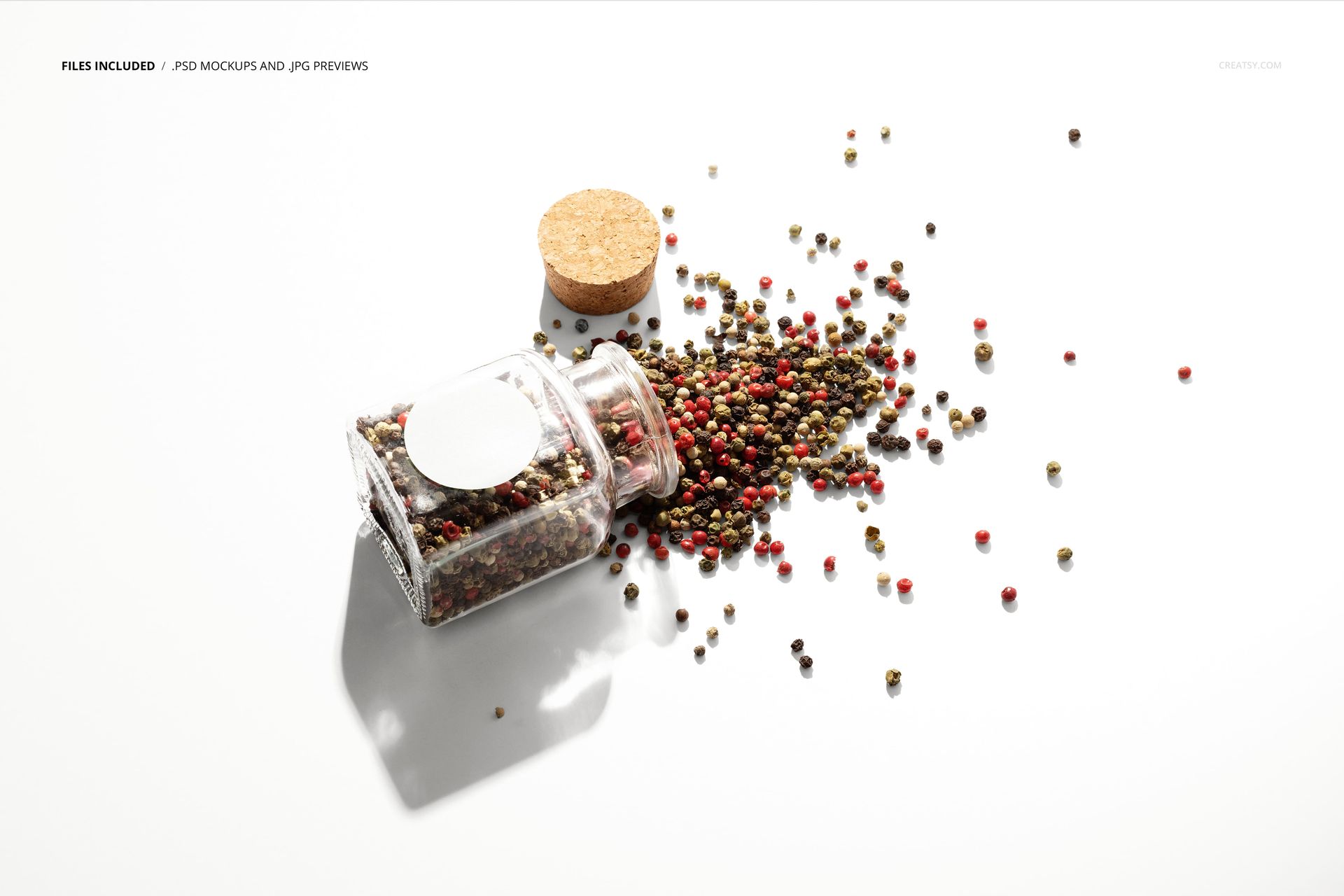 PSD mockup of a transparent spice jar with empty label, cork lid removed, colorful peppercorns spread out.
