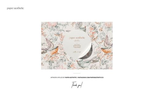 Vintage armchair mockup scene with floral wallpaper, soft window light, and a fluted lampshade in a cozy reading corner.