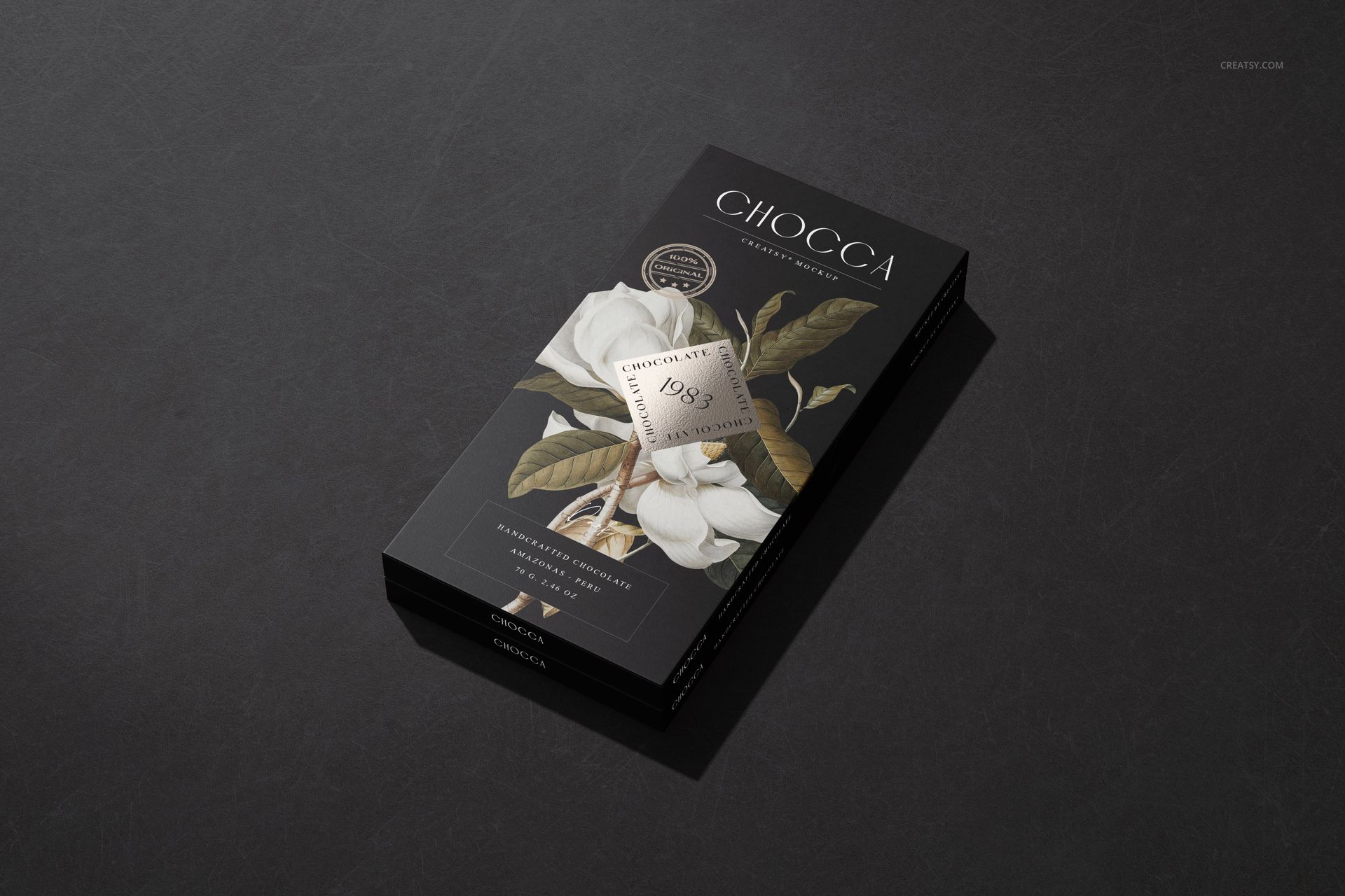 Chocolate bar box mockup featuring a white flower illustration and elegant foil details, displayed on a black background.