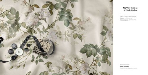 Cream fabric with botanical print featuring leaves and flowers, displayed with buttons and measuring tape in a mockup.