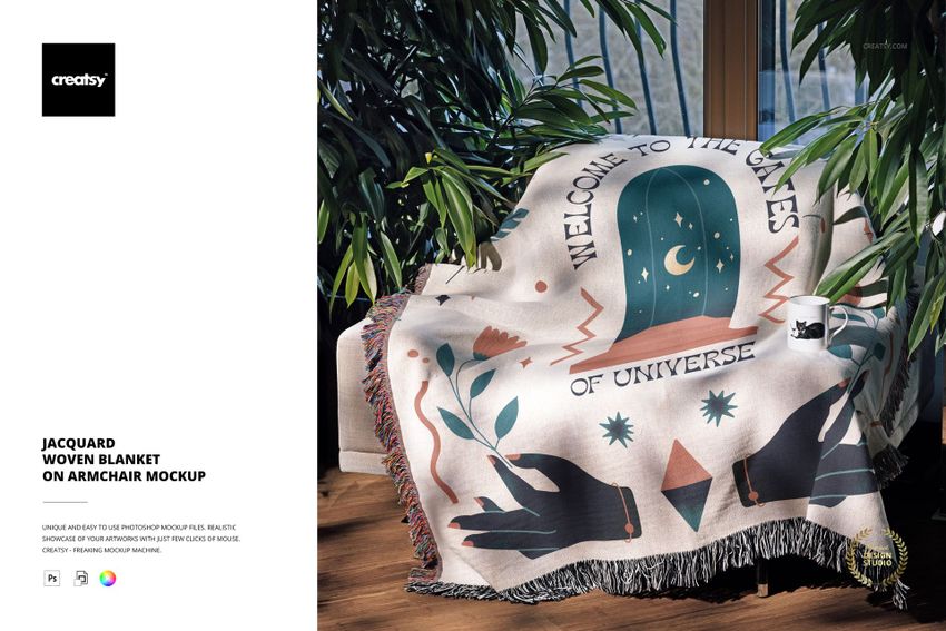 PSD mockup showing a woven blanket with artistic symbols and text, displayed on an armchair near a window with greenery.