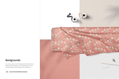 Flat lay of a fabric bolt mockup featuring a pink flower pattern, shown alongside thread spools and scissors.