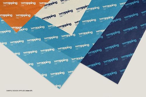 Assorted sheets of wrapping tissue paper mockup displayed in overlapping layers, featuring blue, orange, and cream colors.