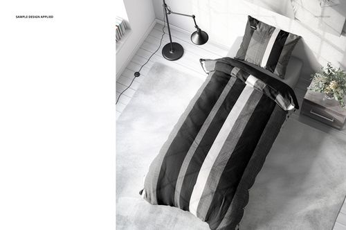 Mockup of single bed bedding set featuring bold vertical stripes in black, gray, and white, viewed from above.